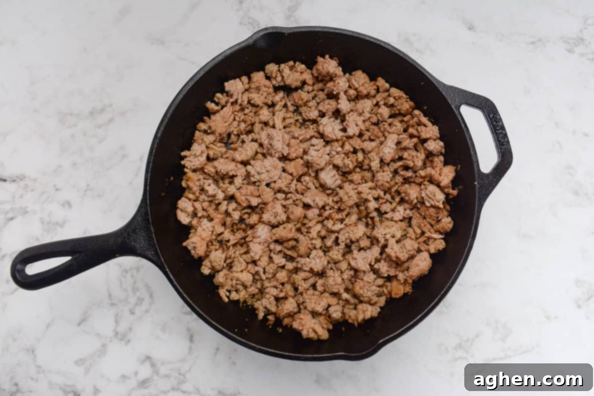 Weight Watchers' Timeless Ground Turkey Shepherd's Pie 6 A cast iron skillet with cooked ground turkey
