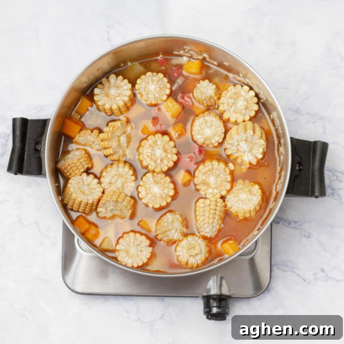 Rice and vegetables simmering in shrimp broth