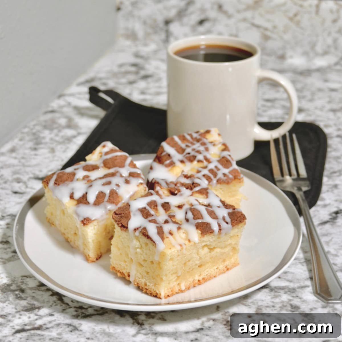 Indulge in Slow Cooker Coffee Cake The Weight Watchers Way 5 A steaming cup of coffee next to a perfectly baked slice of cinnamon streusel coffee cake, indicating a cozy and delicious moment.