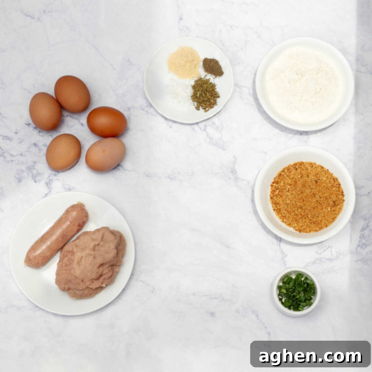 Wow Your Brunch Guests with Weight Watchers Scotch Eggs 3 A collection of fresh ingredients laid out for making Scotch Eggs, including eggs, ground meat, flour, and spices.