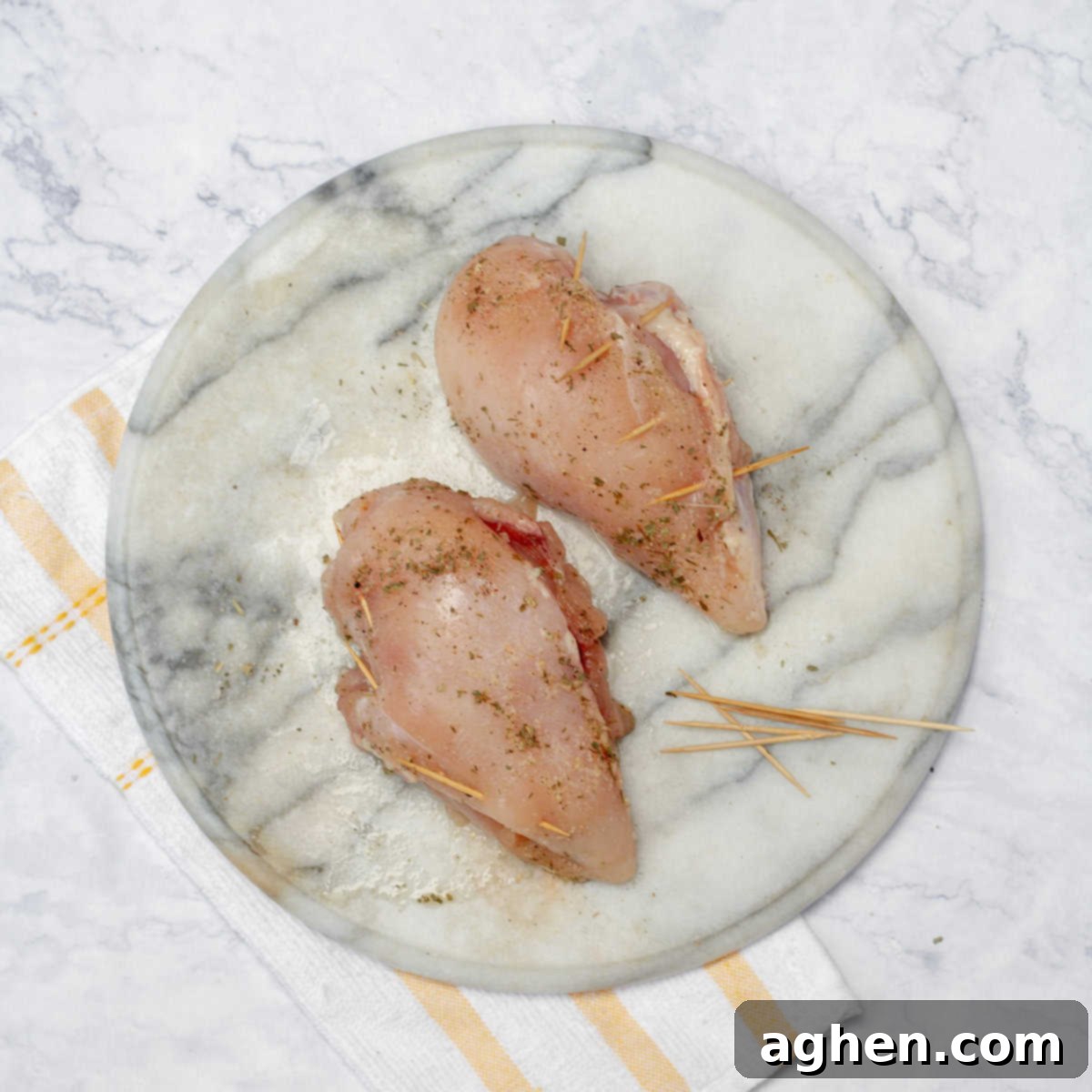 Gourmet Mushroom and Mozzarella Stuffed Chicken 7 Securing the openings of the stuffed chicken breasts with toothpicks before baking.