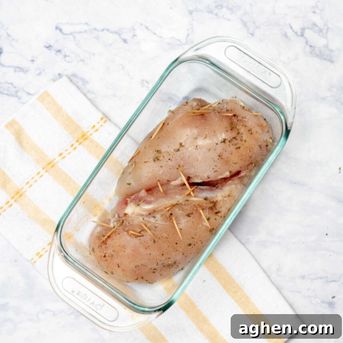 Gourmet Mushroom and Mozzarella Stuffed Chicken 8 Stuffed chicken breasts arranged in a baking dish, ready for the oven.