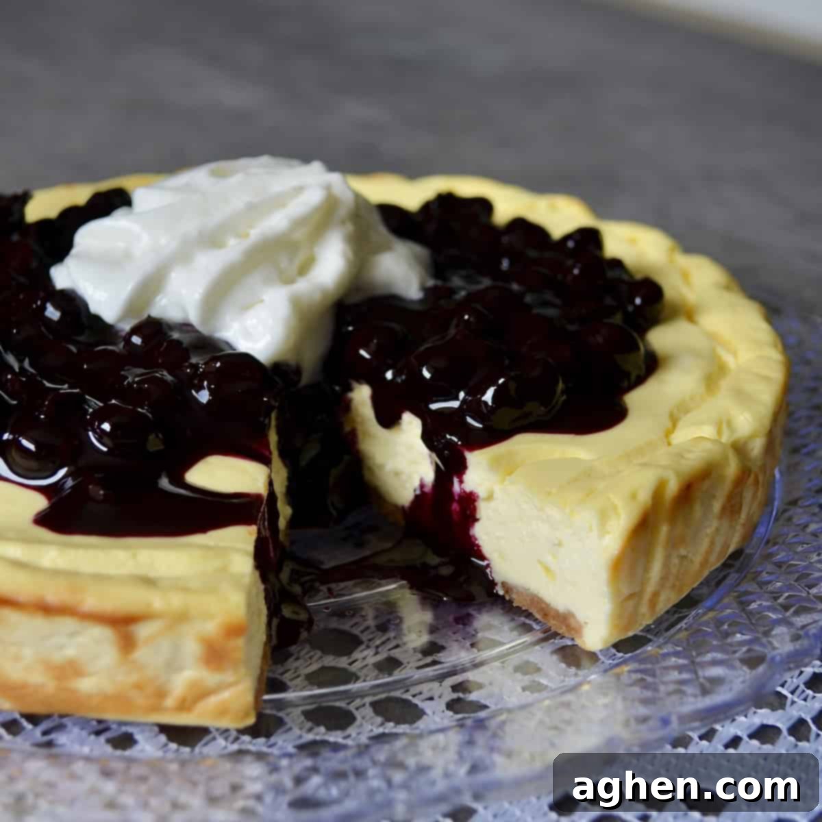 Smart Indulgence New York Cheesecake with Blueberry Compote 2 Weight Watchers New York Cheesecake with a vibrant blueberry compote topping, ready to be served