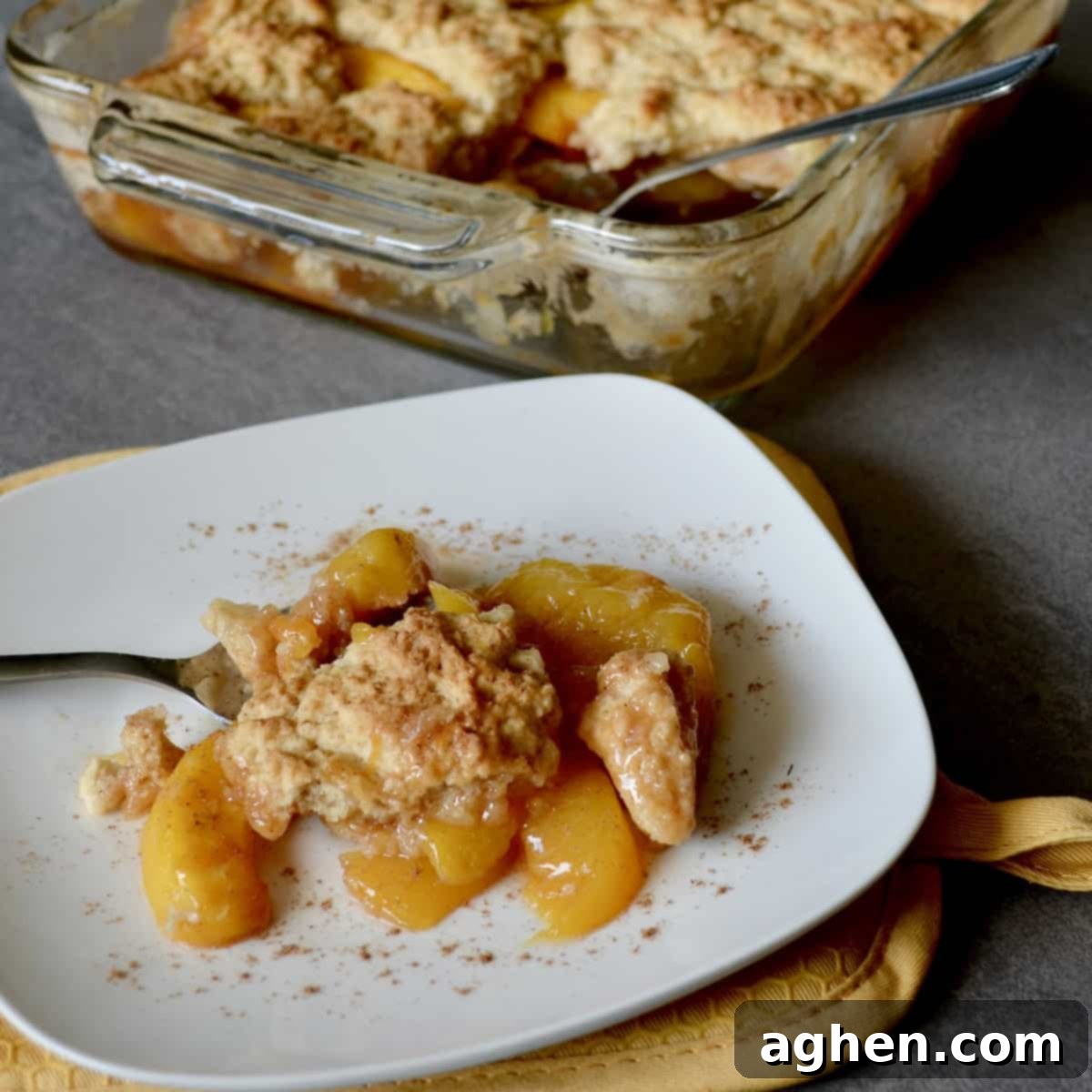 Light and Luscious Peach Cobbler 2 Plated peach cobbler with cinnamon
