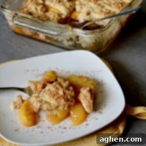 Plated peach cobbler with cinnamon