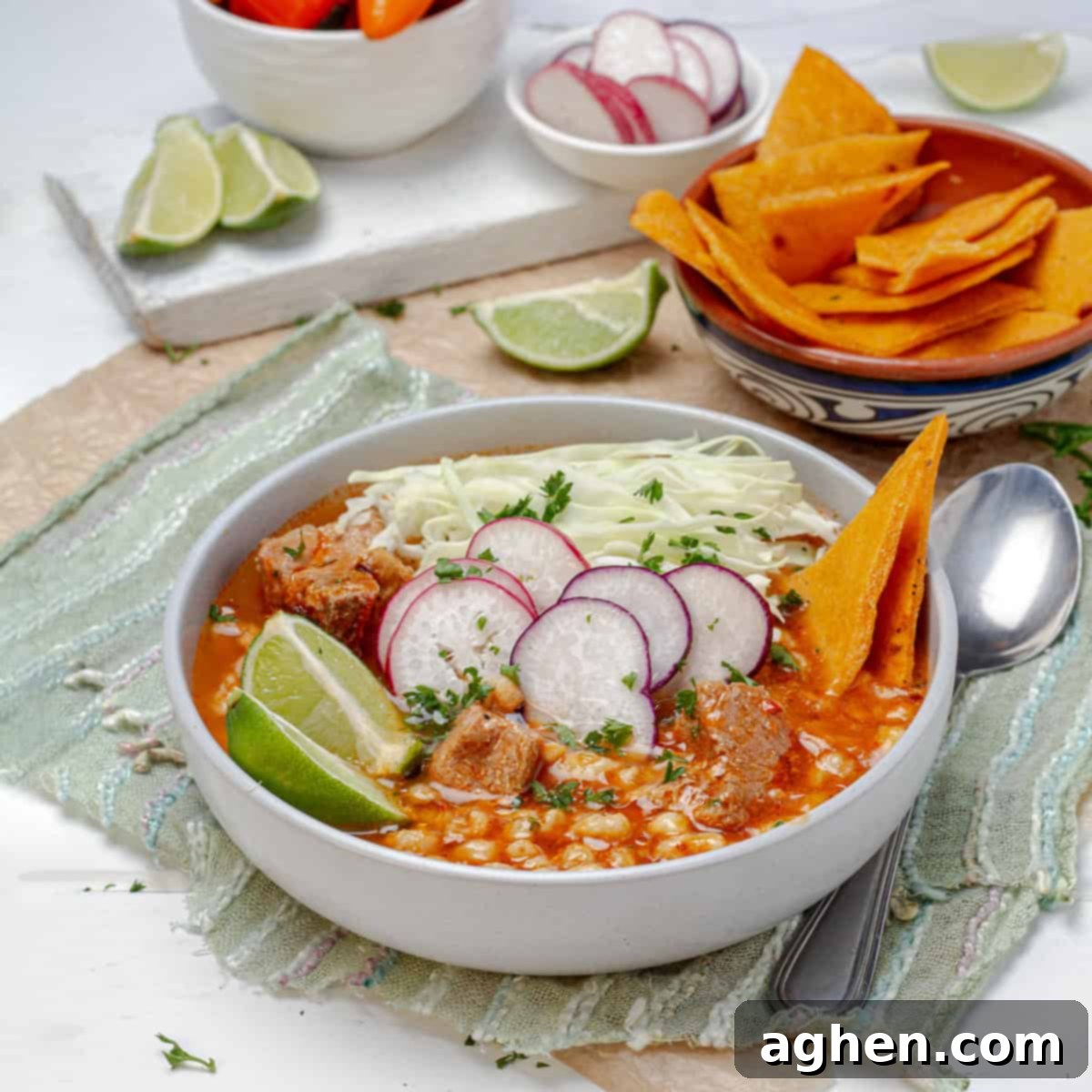 Light Pozole: All the Flavor, Less Guilt 2 Light pozole soup with fresh garnishes in a large bowl.