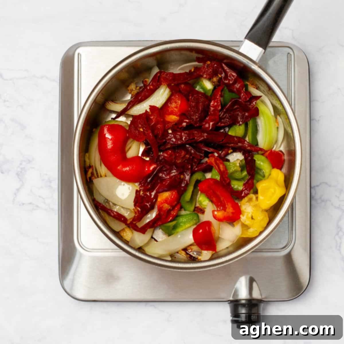 Light Pozole: All the Flavor, Less Guilt 6 Vegetables and aromatics sauteing in a pan.