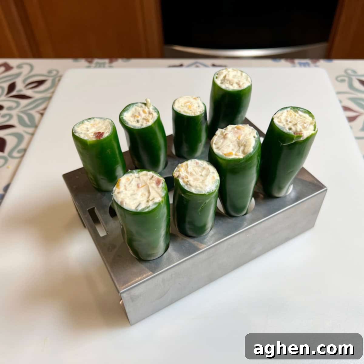 Competition BBQ Veteran's Smoked Bacon Wrapped Jalapeno Poppers 6 Jalapeno peppers being stuffed with cream cheese filling