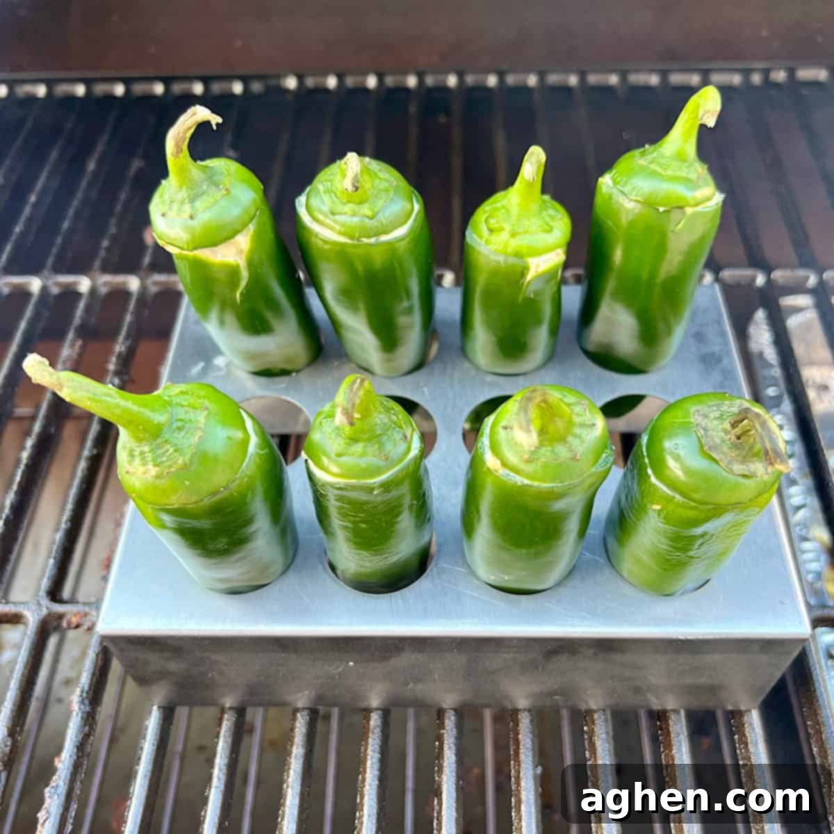 Competition BBQ Veteran's Smoked Bacon Wrapped Jalapeno Poppers 8 Jalapeno poppers smoking on the grill