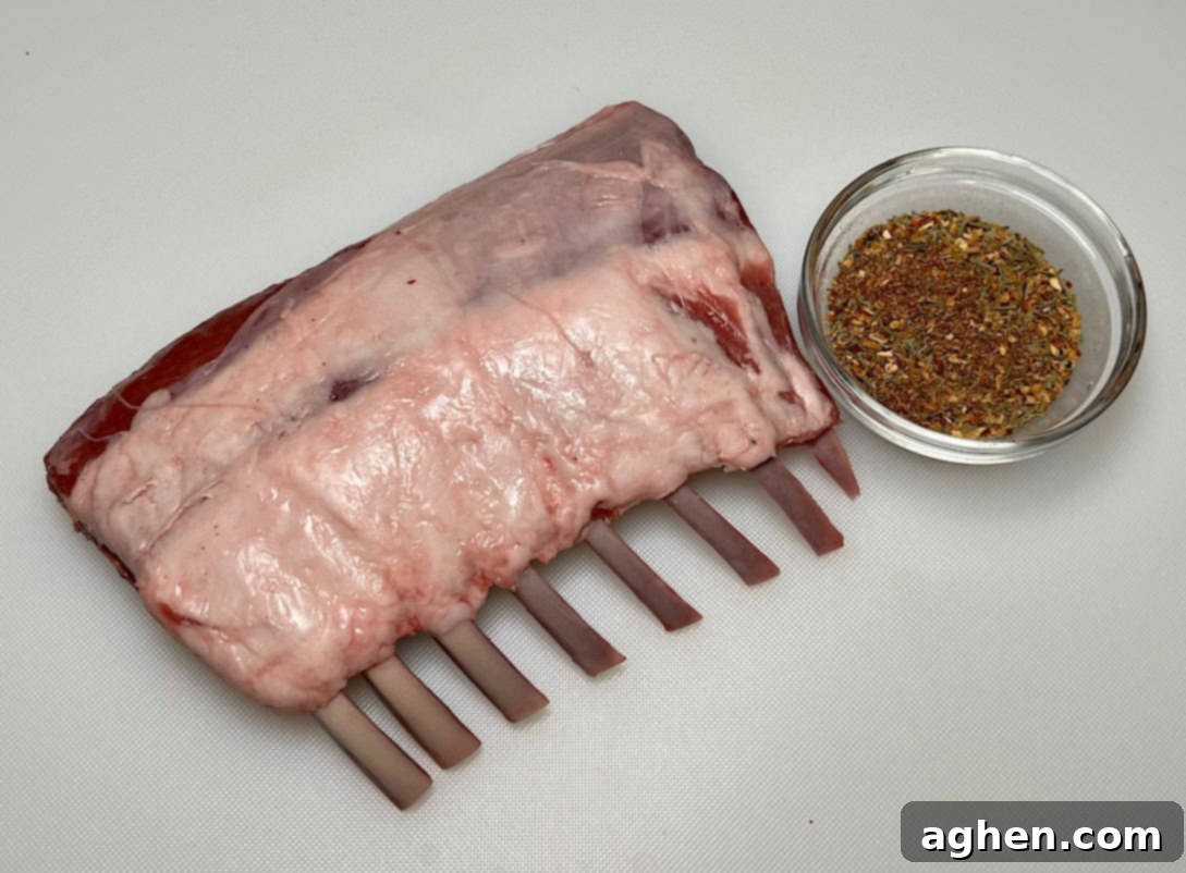 Perfectly Smoked Rack of Lamb, Surprisingly Simple 3 Applying Dijon mustard to a rack of lamb