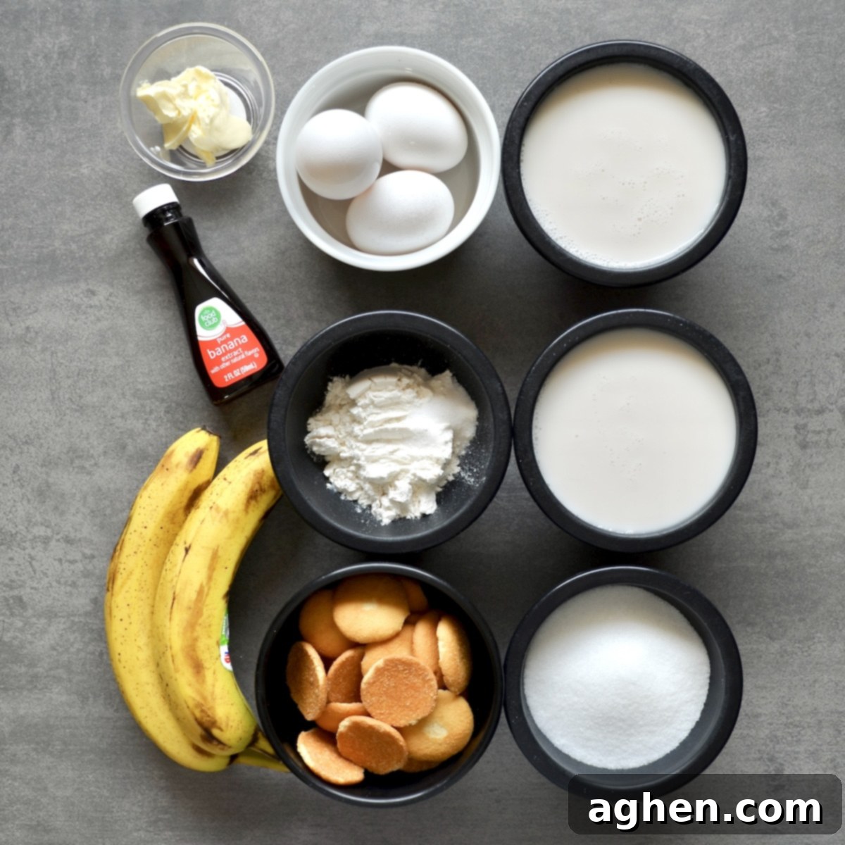 Light and Creamy Weight Watchers Banana Pudding 3 A flat lay image displaying all the ingredients needed to prepare the Weight Watchers banana pudding, including bananas, monk fruit sweetener, flour, eggs, almond milk, light butter substitute, banana extract, and vanilla wafers.