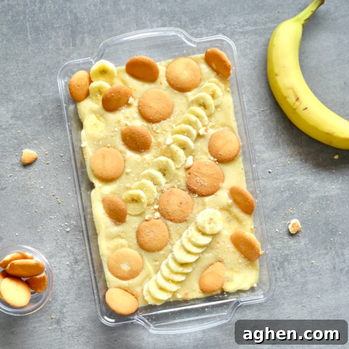 Light and Creamy Weight Watchers Banana Pudding 7 A beautifully decorated banana pudding in a serving dish, topped with fresh banana slices and vanilla wafer cookies.