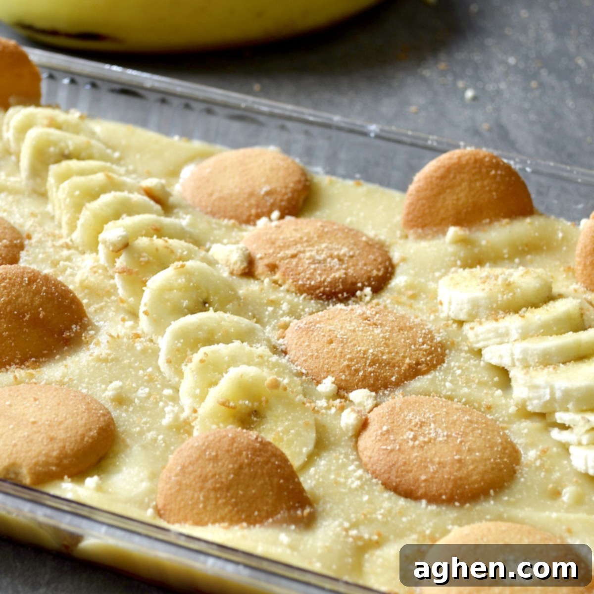 Light and Creamy Weight Watchers Banana Pudding 8 Close-up view of a serving of Weight Watchers banana pudding, showing the layers of creamy pudding, fresh banana slices, and vanilla wafer cookies.