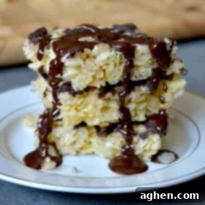 Stack of rice krispie treats with melted chocolate