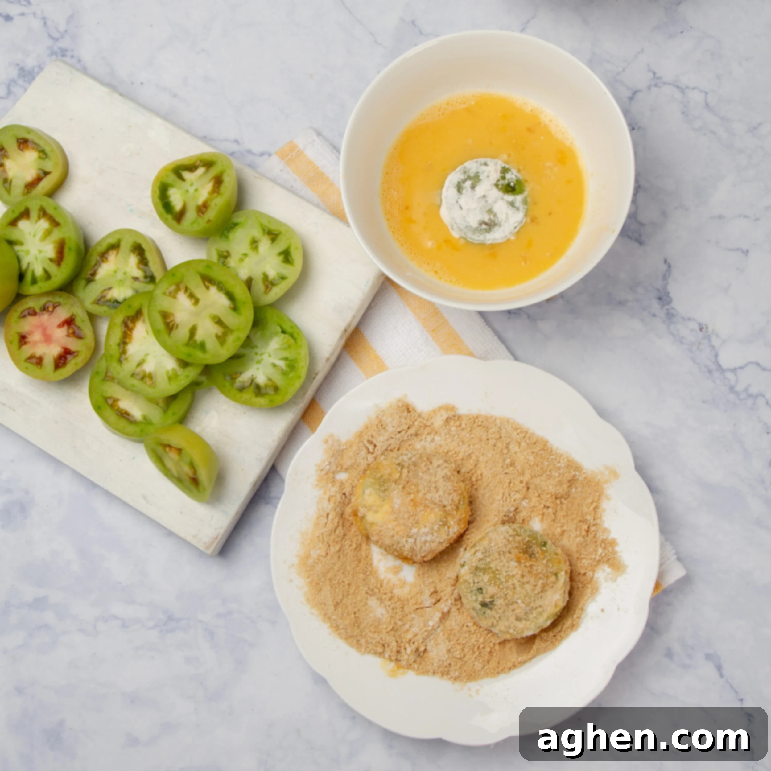 Golden Crispy Air-Fried Green Tomatoes 5 Green tomato slices next to an egg wash and bread crumbs.