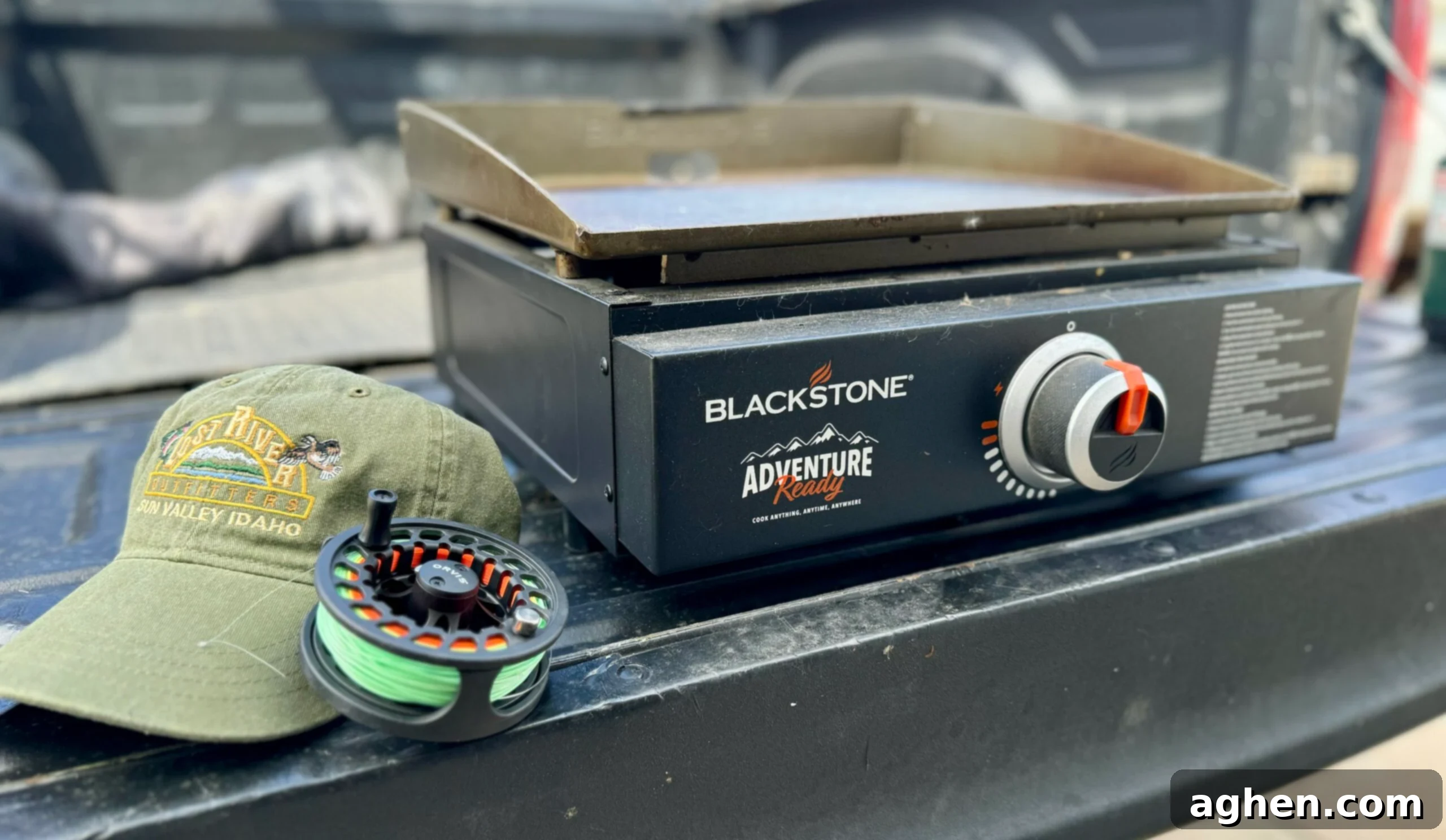 A Blackstone griddle set up at a campsite, ready for cooking