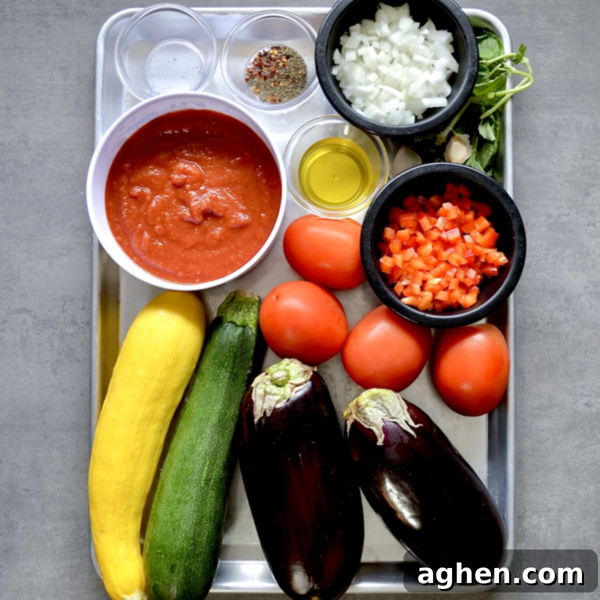Late Summer Light Ratatouille Bake 3 Ingredients for ratatouille laid out on a kitchen counter.