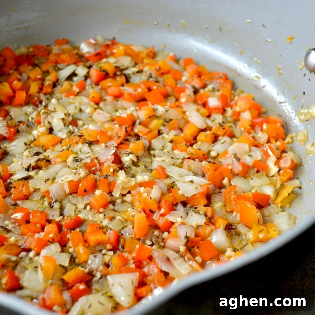Late Summer Light Ratatouille Bake 4 Sautéing vegetables for tomato sauce in a pan.