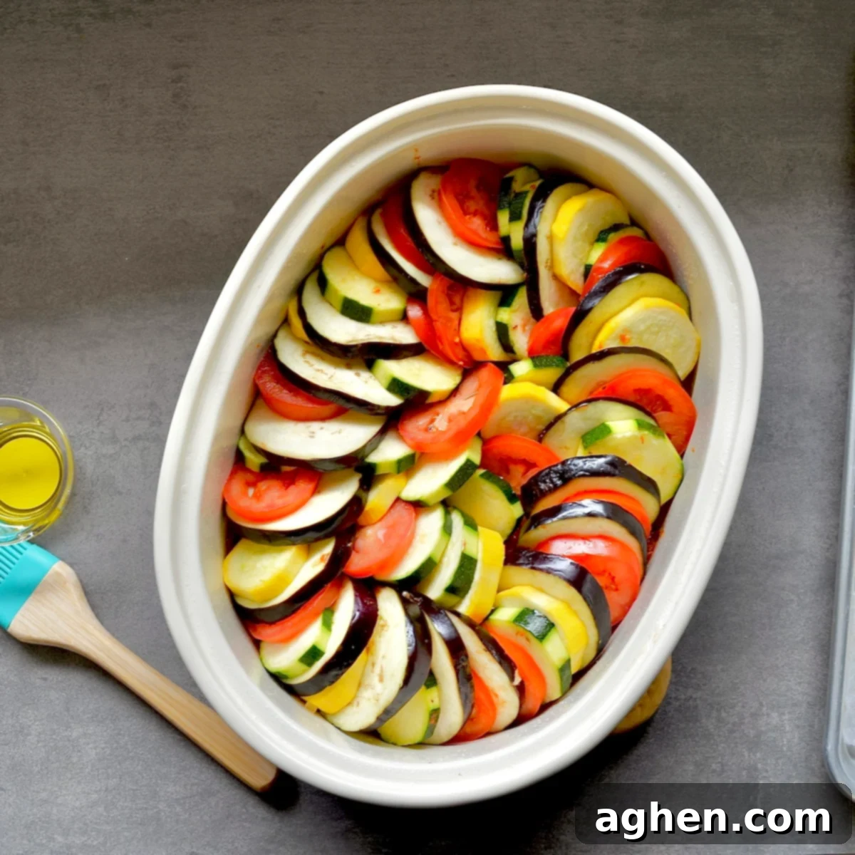 Late Summer Light Ratatouille Bake 6 Unbaked ratatouille with layered vegetables in a spiral pattern.