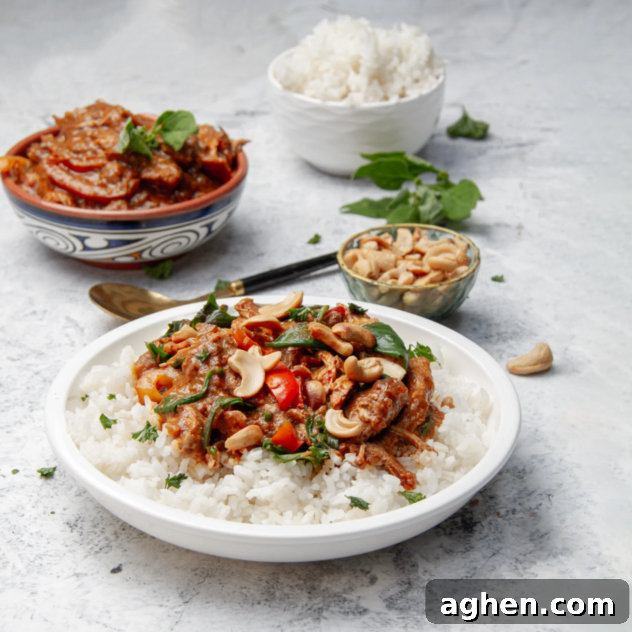 Comforting Slow Cooker Chicken Pumpkin Curry 2 Thick and fragrant Slow Cooker Chicken Pumpkin Curry in a dish over rice, garnished with fresh herbs.