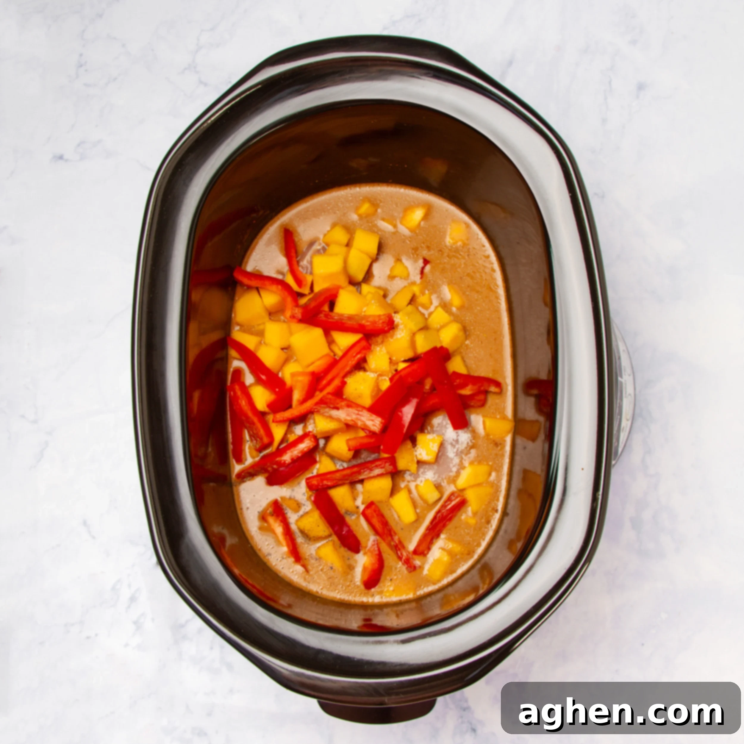 Comforting Slow Cooker Chicken Pumpkin Curry 6 Bell peppers added to the chicken, pumpkin, and curry sauce in the Instant Pot during the final cooking stage.