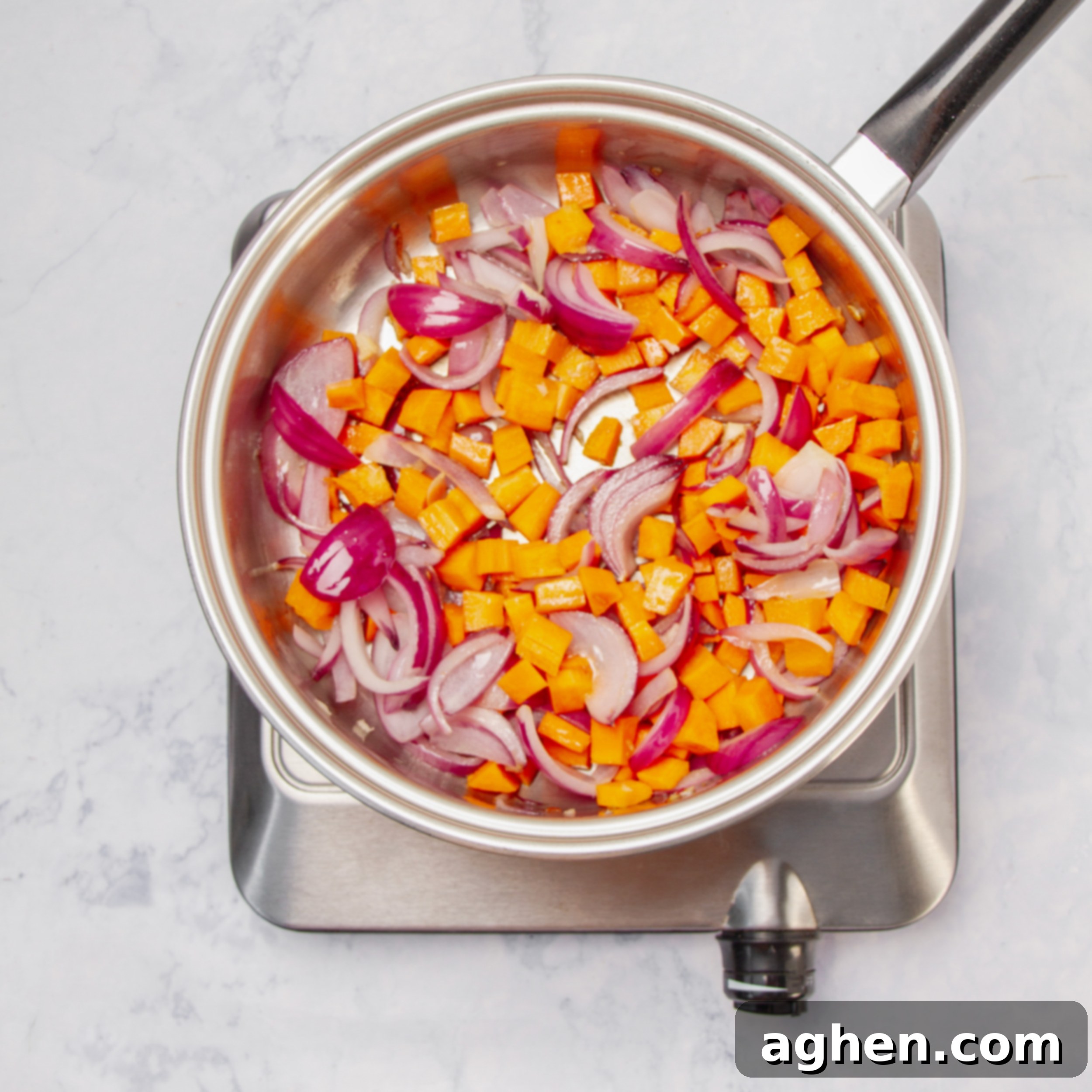 Fall Harvest Chicken Casserole A Weight Watchers Classic 4 Aromatics and vegetables sautéing in a pan.