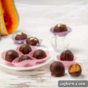 Weight Watchers Chocolate Pumpkin Truffles: The Ultimate Fall Treat 7 Healthy yet indulgent Chocolate Pumpkin Truffles on a plate with some on a countertop beside it.