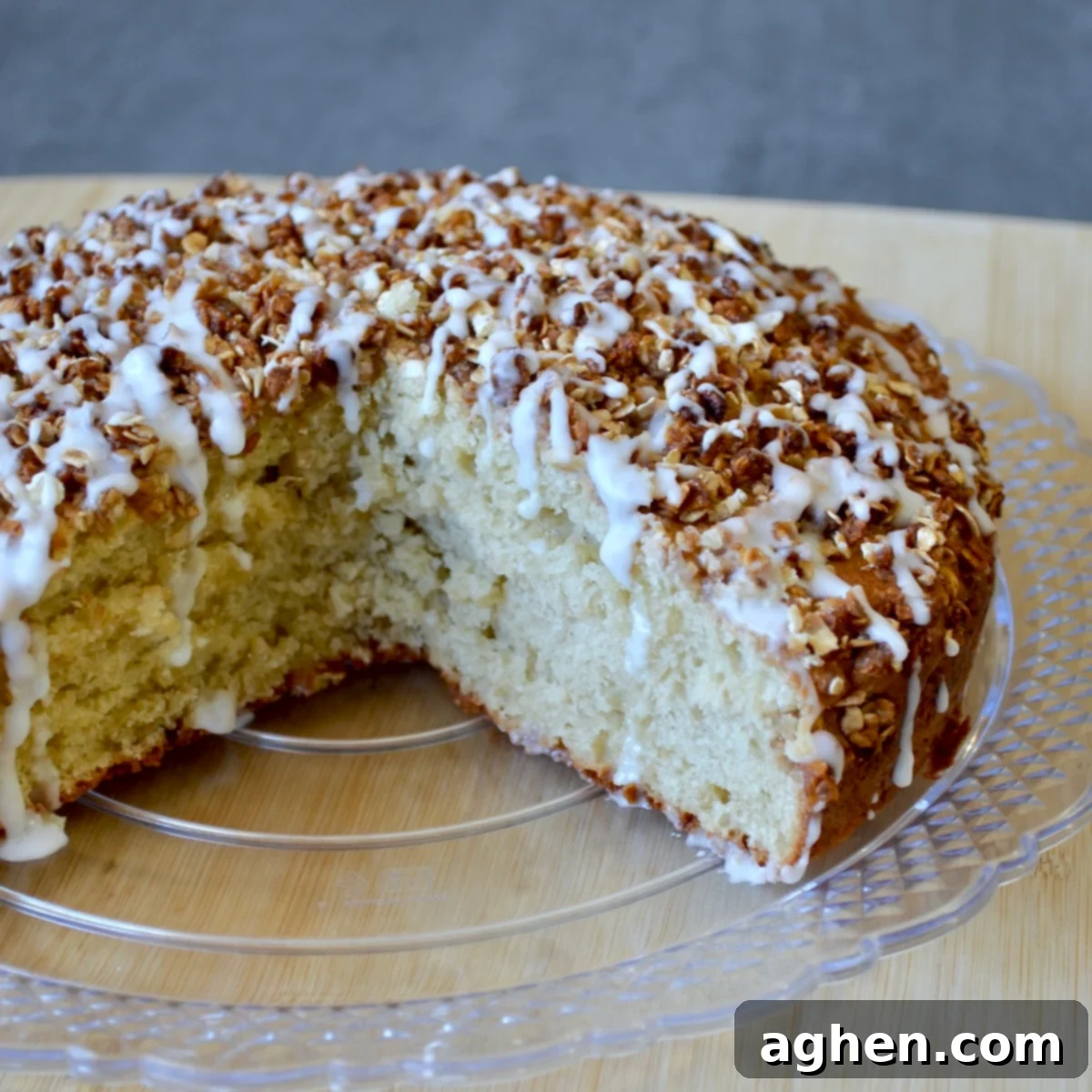 Weight Watchers Friendly Brown Sugar Oat Coffee Cake Perfection 7 A freshly baked Weight Watchers brown sugar oat coffee cake with a light glaze drizzled over its golden, crispy oat topping, served in a square dish.