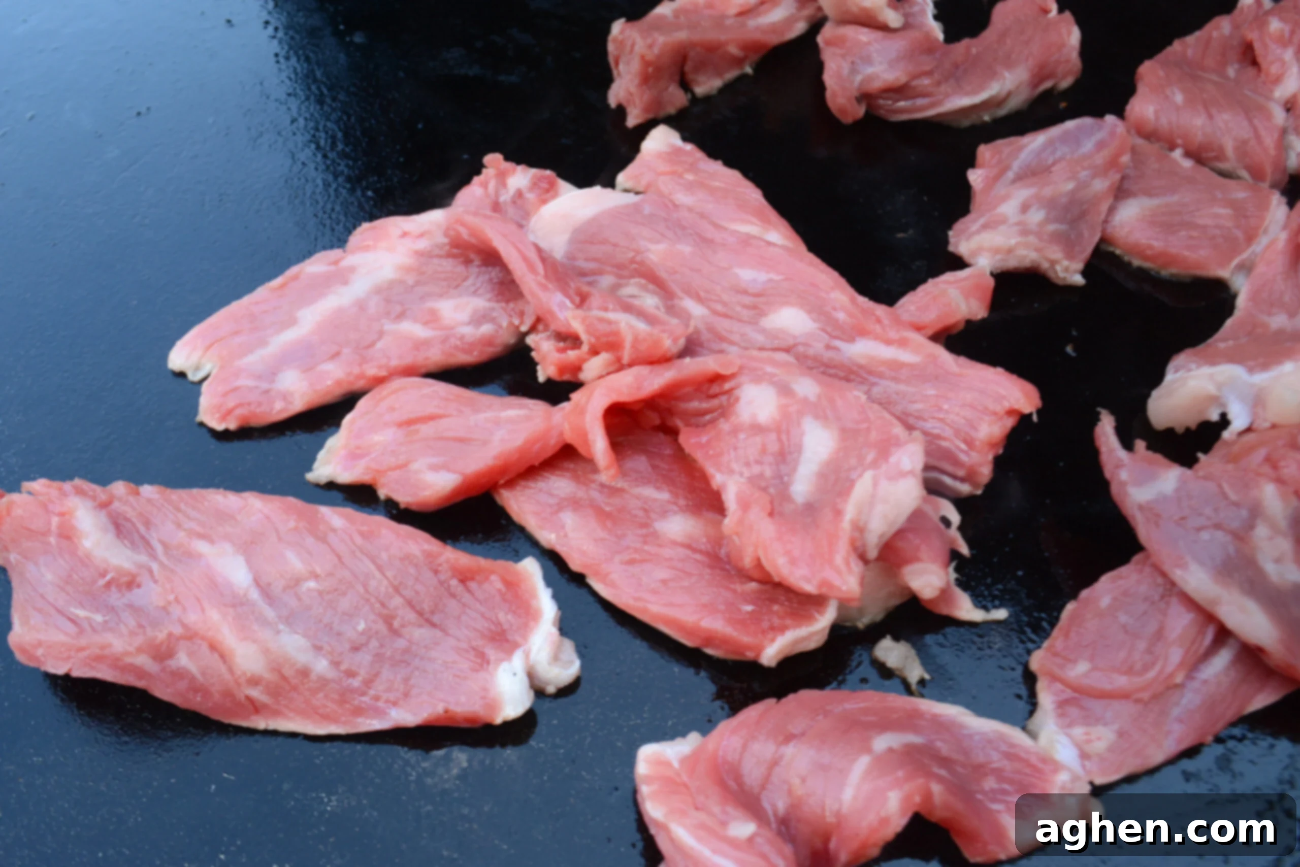 Blackstone Steak Quesadillas So Good They're Eaten Off the Griddle 6 sliced steak cooking on the blackstone griddle.