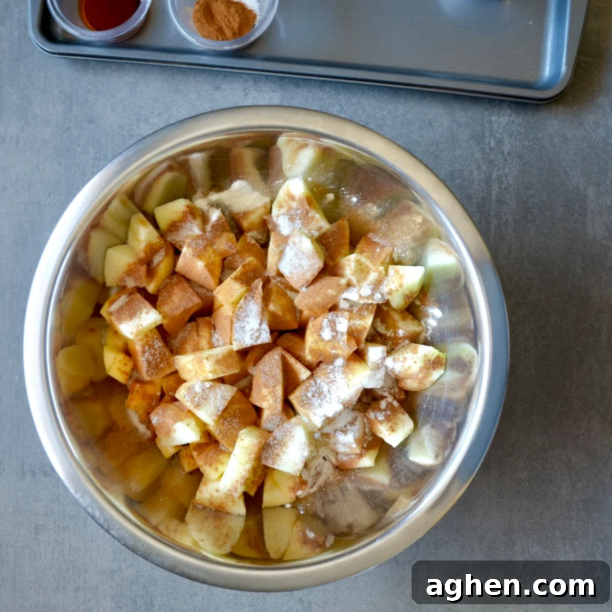 Guilt-Free Apple Crisp 4 Close-up of apple pieces coated with cinnamon and sweetener in a bowl
