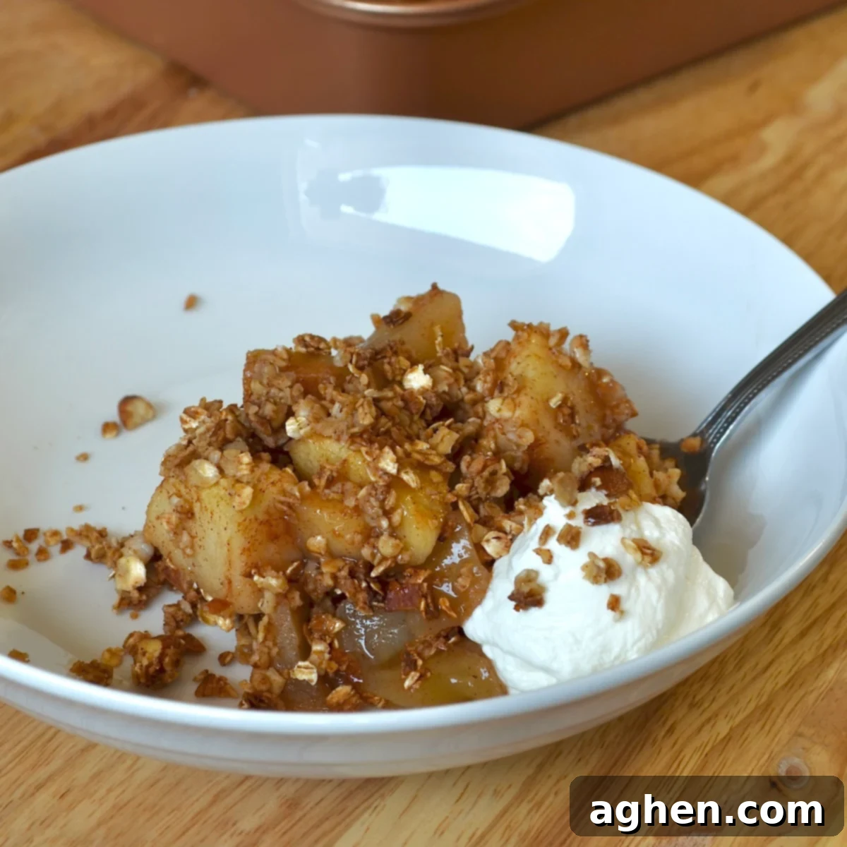 Guilt-Free Apple Crisp 6 Warm apple crisp served in a white bowl, ready to eat