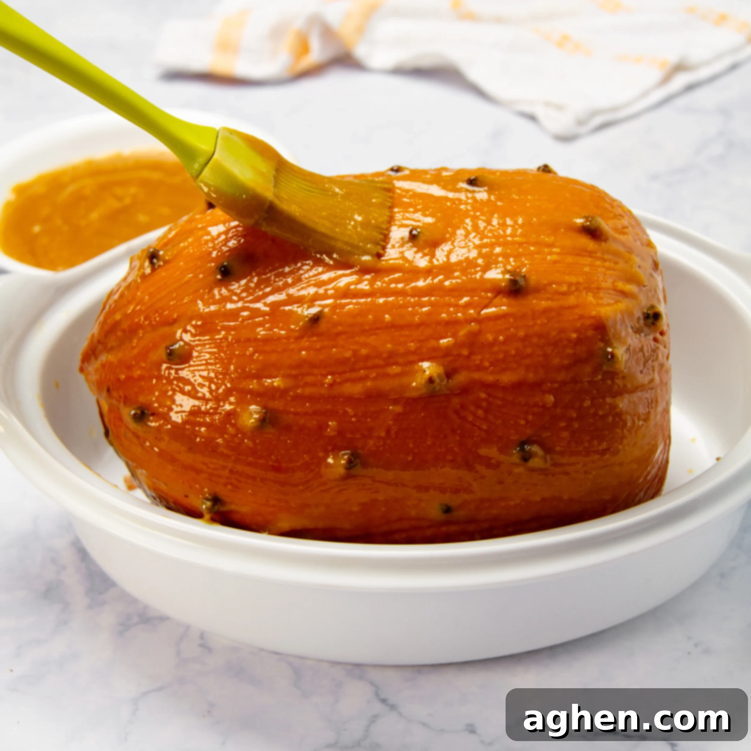 Weight Watchers Holiday Ham-Style Glazed Turkey 7 Glaze being brushed onto the uncooked turkey ham.