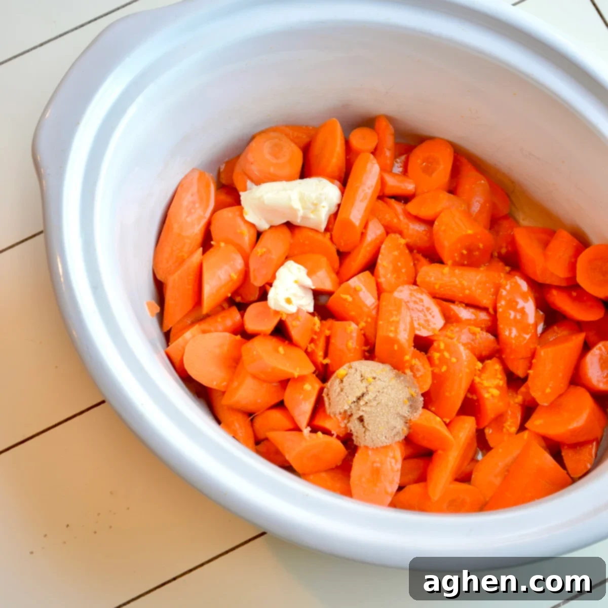 Slow Cooker Golden Candied Carrots 4 Candied carrots ingredients in a slow cooker, before cooking.