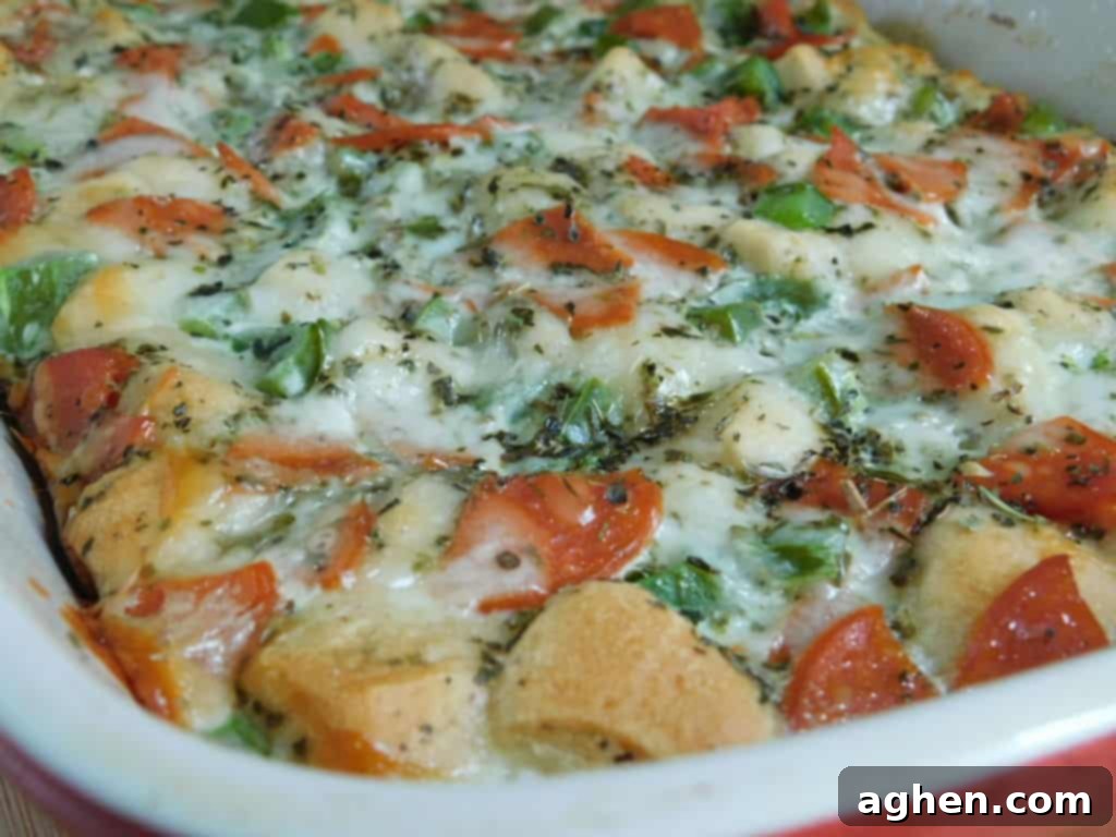 Smart Start: Weight Watchers Breakfast Casseroles for Any Gathering 5 A bubbly and cheesy Pizza Bubble-Up breakfast casserole in a baking dish, ready to be enjoyed.