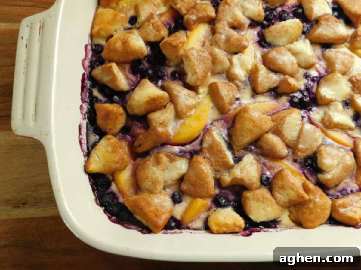 Smart Start: Weight Watchers Breakfast Casseroles for Any Gathering 7 A vibrant Blueberry Peach Cream Cheese Bake, showcasing juicy fruits and a golden crust.