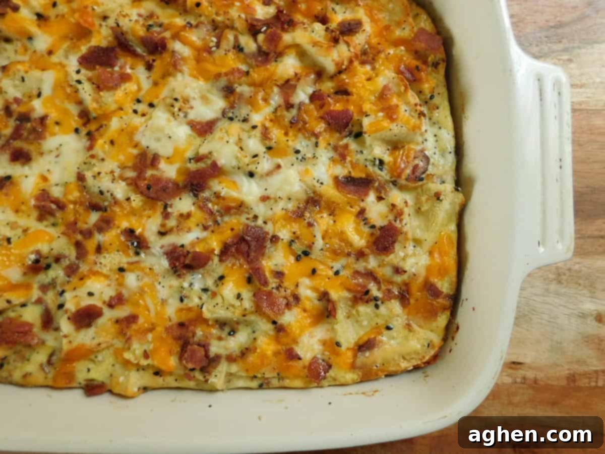 Smart Start: Weight Watchers Breakfast Casseroles for Any Gathering 9 A delightful Everything Bagel Casserole in a white baking dish, topped with seasoning.