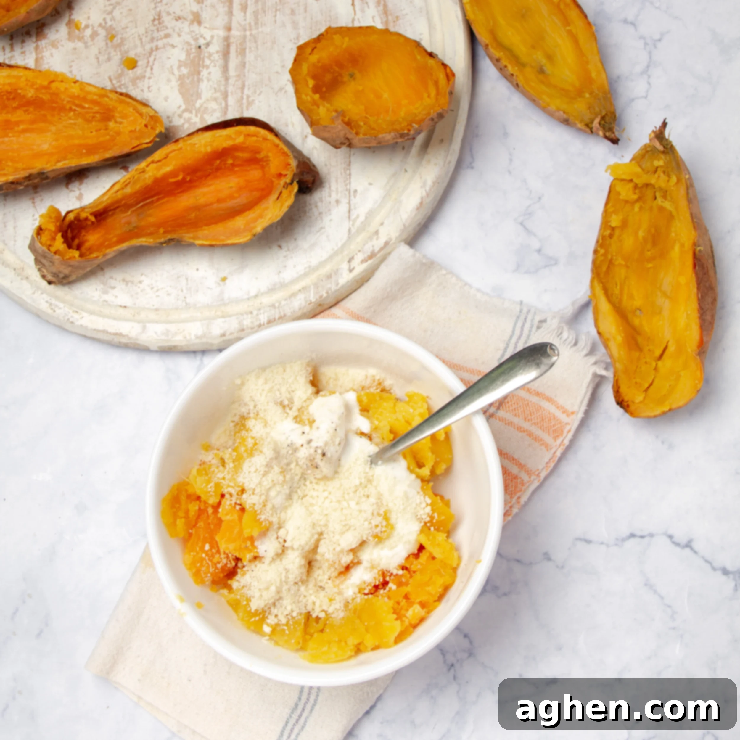 Ultimate Twice-Baked Sweet Potatoes 6 Removing the cooked potato from the skin.