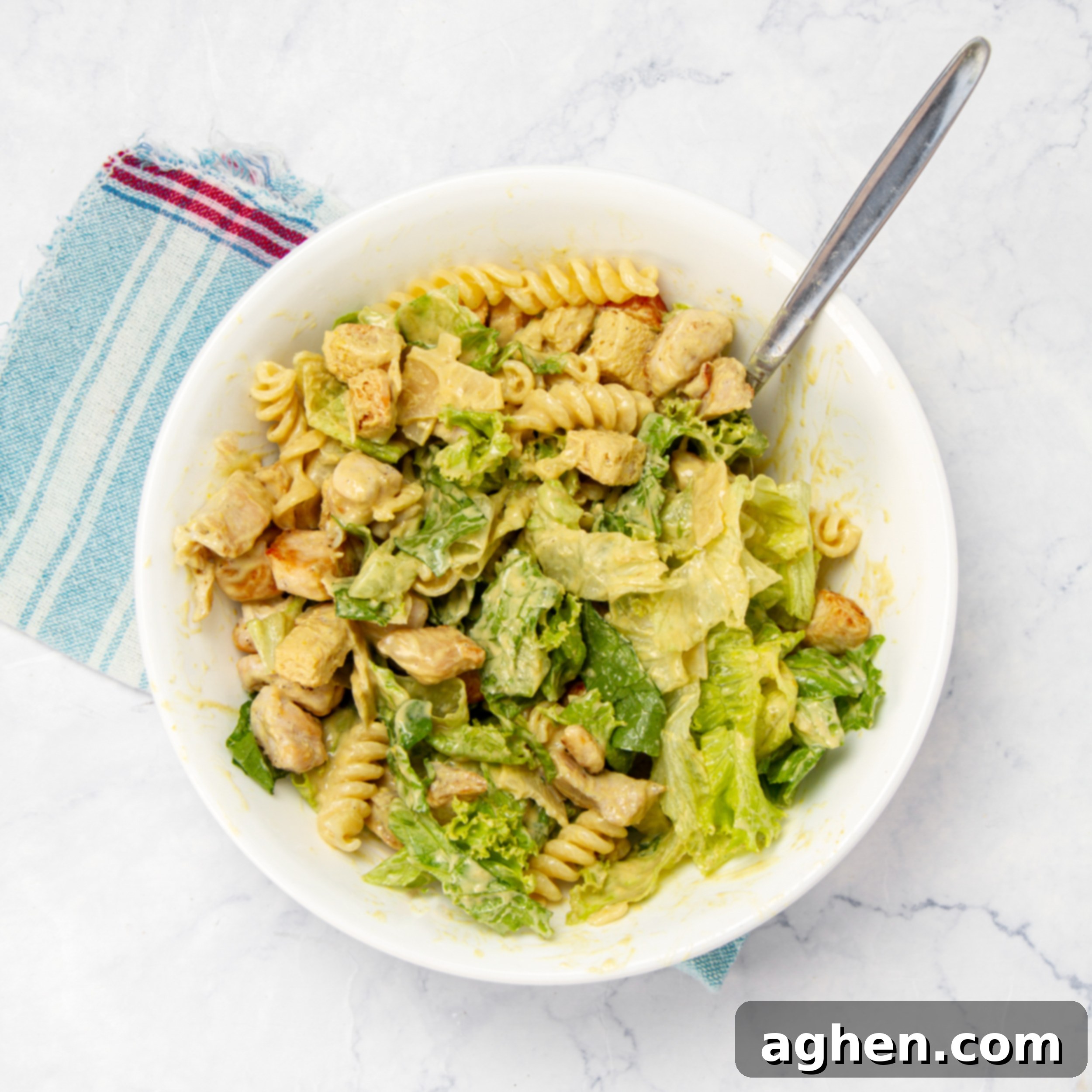 Weight Watchers' Iconic Chicken Caesar Pasta Salad 6 Pasta, veggies, and cooked chicken mixed in the homemade Caesar dressing.