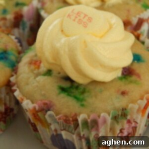 Funfetti Cupcakes with Creamy Vanilla Pudding Frosting 2 A perfectly frosted funfetti cupcake, ready to be enjoyed.