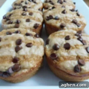 Sticky Sweet Caramel Apple Muffins 2 A freshly baked caramel apple muffin with caramel drizzle.