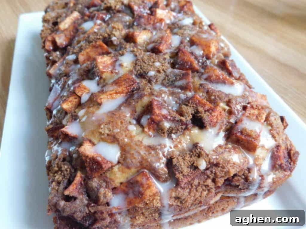 Cinnamon Swirl Apple Fritter Bread 2 Freshly baked Apple Fritter Bread loaf, sliced and ready to serve