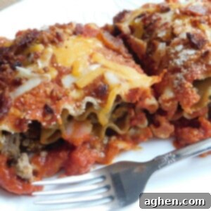 Close-up of a single Bacon Cheeseburger Lasagna Roll in a dish
