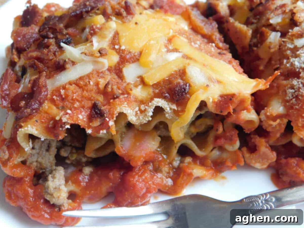Ultimate Bacon Cheeseburger Lasagna Rolls 8 Individual Bacon Cheeseburger Lasagna Roll served on a plate