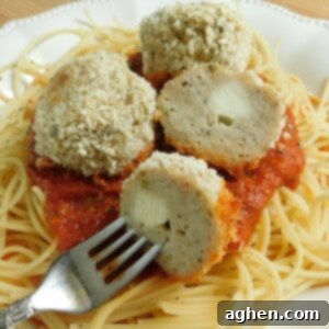 Cheesy Chicken Parmesan Meatballs 2 Baked chicken parmesan meatballs in a serving dish